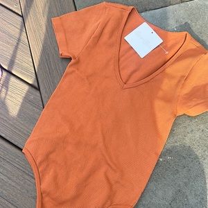 GYPSY + JADE ORANGE RIBBED‎ BODYSUIT